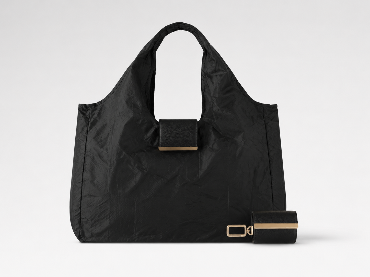 ClipTote keychain tote in black with gold hardware and clip pouch