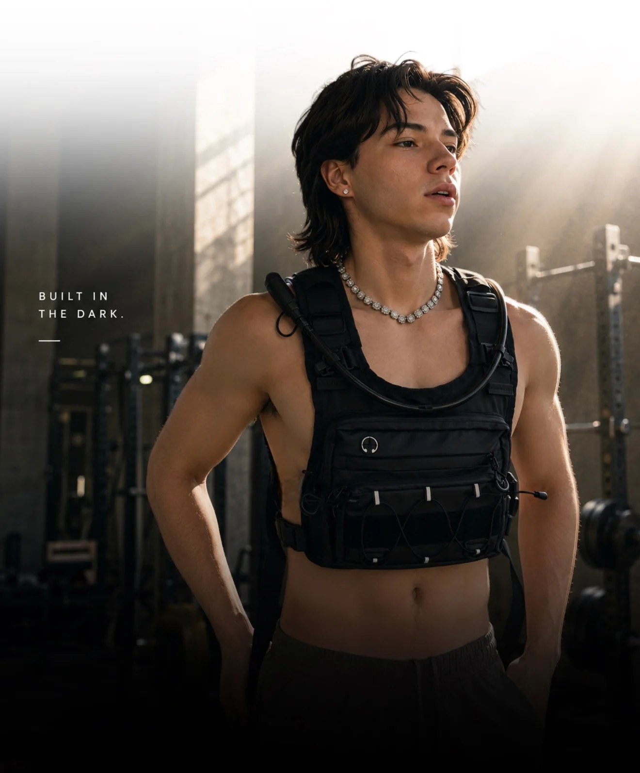 Athlete training in a gym wearing the CoreFlow hydration vest in black